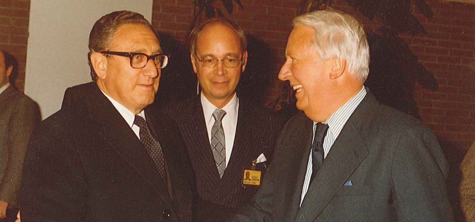 henry kissinger and his former pupil, klaus schwab, welcome former uk pm ted heath at the 1980 wef annual meeting.